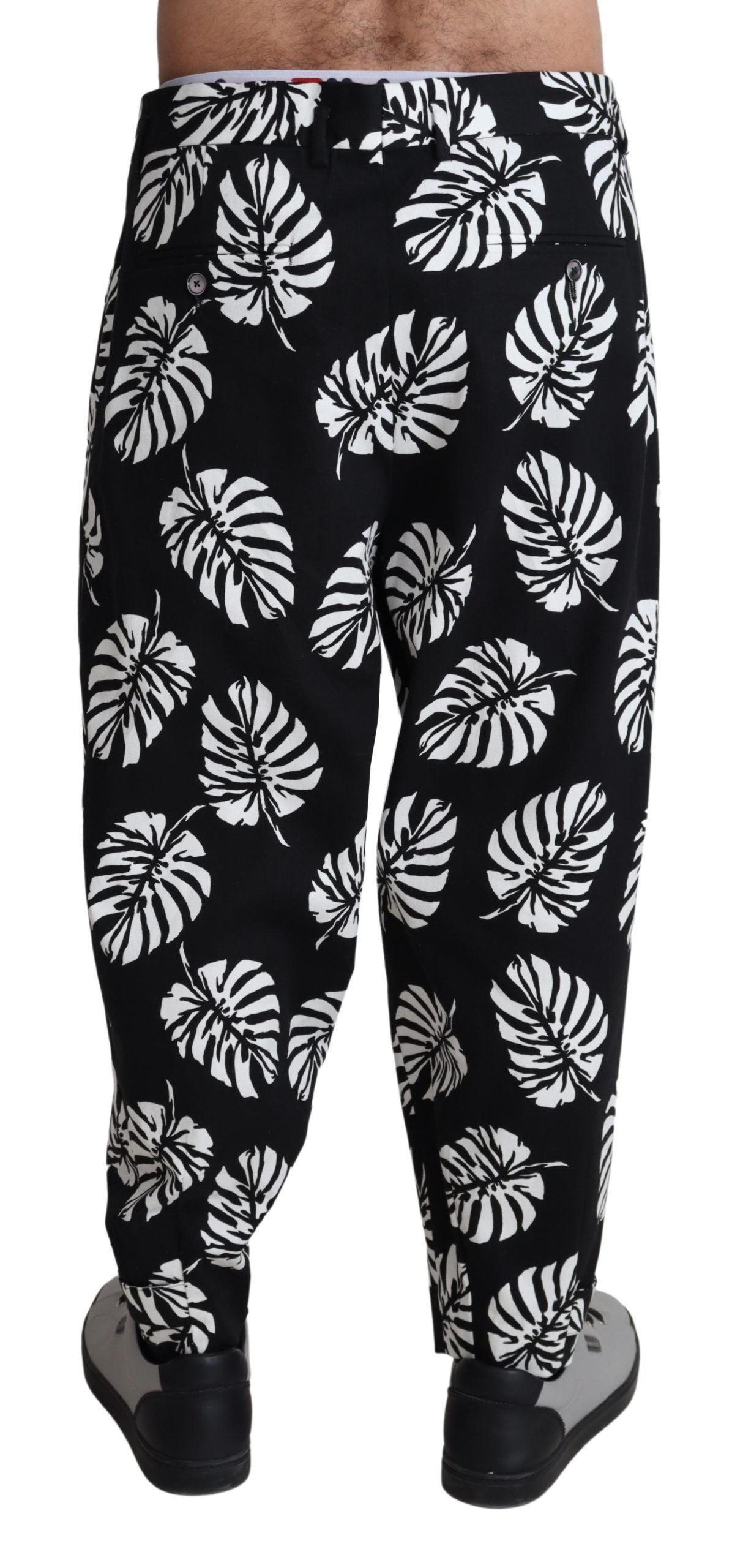 Pantalones elegantes de algodón con estampado de hojas de palmera