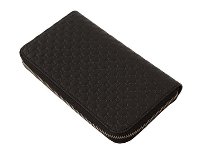 Elegante cartera de piel negra con cremallera