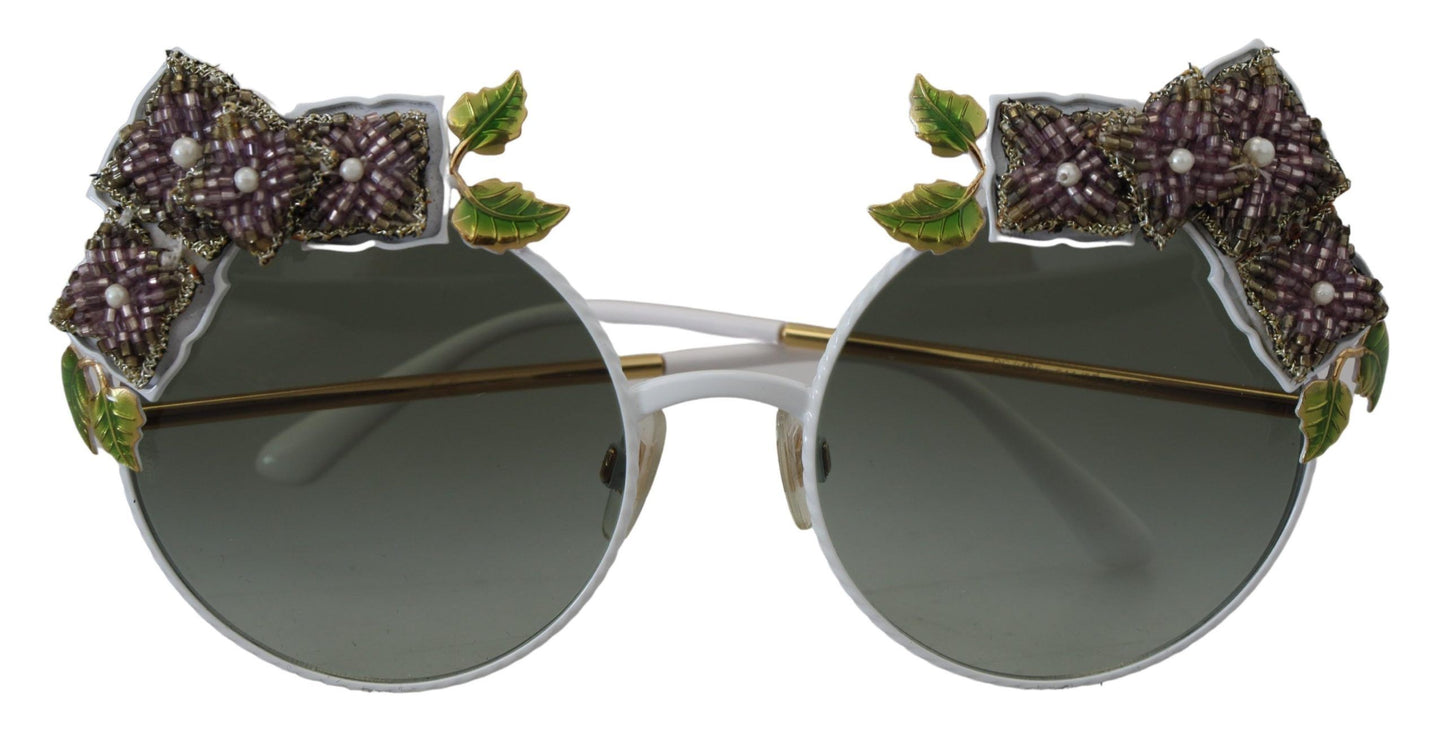 Elegantes gafas de sol doradas con adornos florales