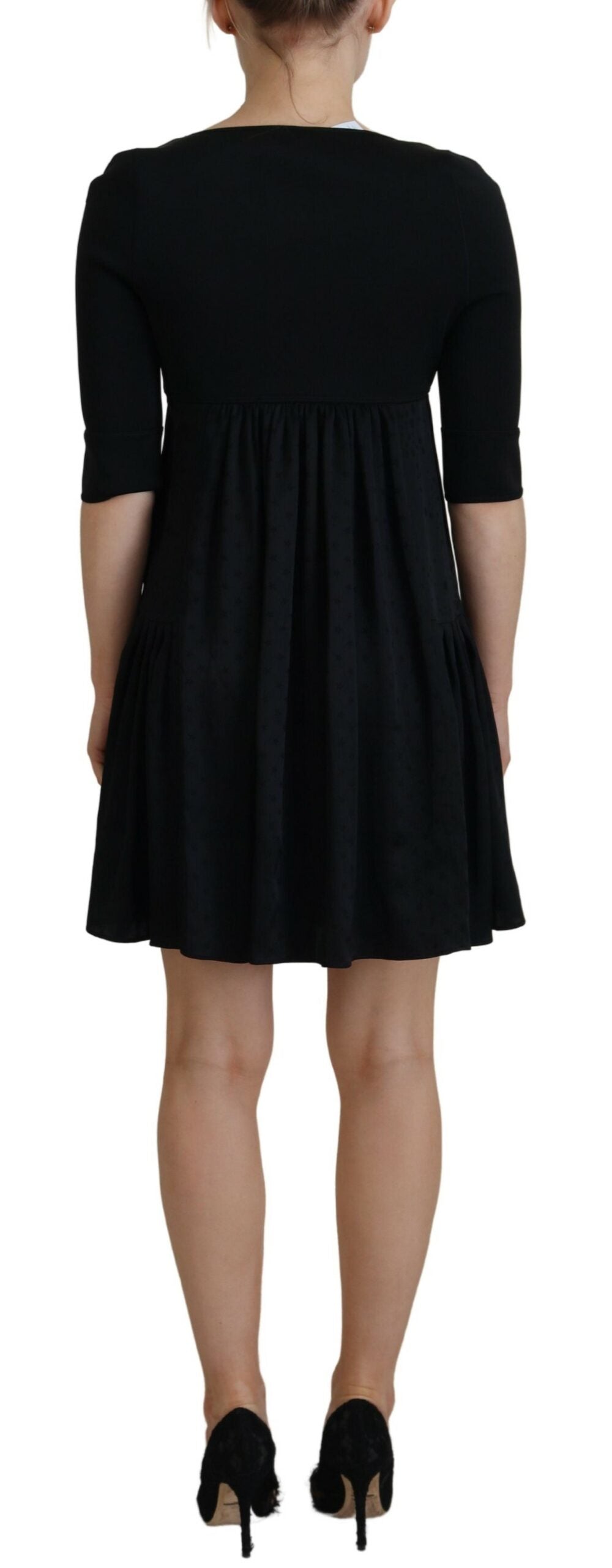 Vestido tubo de acetato negro con mangas cortas y corte en A