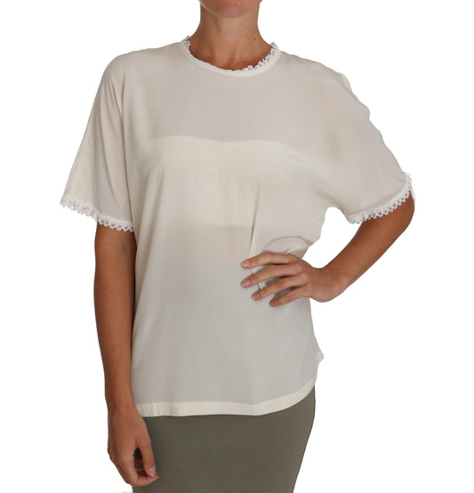 Blusa de seda color crema con detalles de encaje